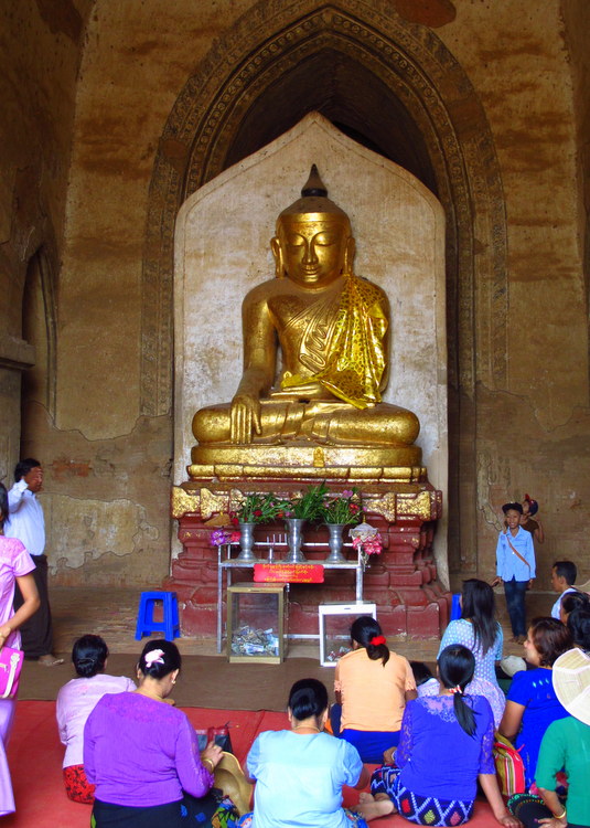 worshipping inside a paya in Bagan, Myanmar